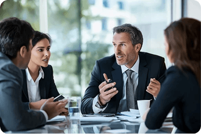 Business meeting discussing insurance plans